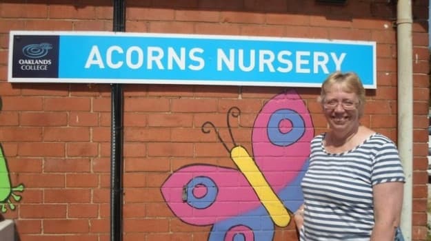 Wendy Taylor standing near sign outside 